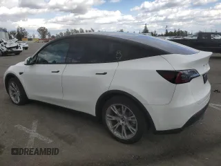 2023 Tesla Model Y Long Range z VIN 7SAYGDEE3PF916132, wystawiony jako Copart lot #51645625 z przebiegiem 28 238 mil mil oraz Szkoda całkowita • Salvage title. Historia ofert i sprzedaży dostępna na DreamBid. Obrazek 2.