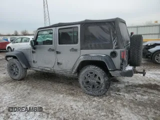 2015 Jeep Wrangler Unlimited Willys Wheeler with VIN 1C4BJWDG9FL516493, listed as a Copart auction lot 45098345 with 152,009 mi miles and Salvage Title. Bid and sale history available at DreamBid. Image 2.