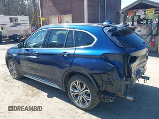 2017 BMW X1 xDrive28i with VIN WBXHT3C33H5F82035, listed as a IAAI auction lot 41944399 with 102,942 mi miles. Bid and sale history available at carsss.com. Image 3.