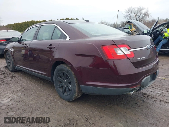 2011 Ford Taurus SE with VIN 1FAHP2DW7BG136988, listed as a IAAI auction lot 42002512 with 145,847 mi miles. Bid and sale history available at carsss.com. Image 3.