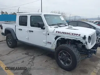 2022 Jeep Gladiator Rubicon z VIN 1C6JJTBG9NL113990, wystawiony jako IAAI lot #38583176 z przebiegiem 31 520 mil mil oraz . Historia ofert i sprzedaży dostępna na DreamBid. Obrazek 1.