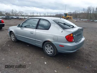 2005 Hyundai Accent GLS with VIN KMHCG35C85U354423, listed as a IAAI auction lot 41939445 with 134,952 mi miles. Bid and sale history available at carsss.com. Image 3.