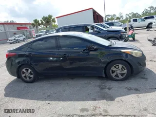 2015 Hyundai Elantra Limited with VIN KMHDH4AE7FU385081, listed as a IAAI auction lot 41911165 with 124,052 mi miles. Bid and sale history available at carsss.com. Image 13.