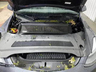 2023 Tesla Model Y Long Range z VIN 7SAYGDEE8PF814874, wystawiony jako Copart lot #56546365 z przebiegiem 20 919 mil mil oraz Szkoda całkowita • Salvage title. Historia ofert i sprzedaży dostępna na DreamBid. Obrazek 11.