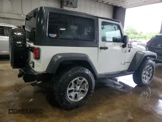 2013 Jeep Wrangler Rubicon 10th Anniversary z VIN 1C4BJWCGXDL543958, wystawiony jako Copart lot #58492255 z przebiegiem 94 455 mil mil oraz Szkoda całkowita • Salvage title. Historia ofert i sprzedaży dostępna na DreamBid. Obrazek 3.