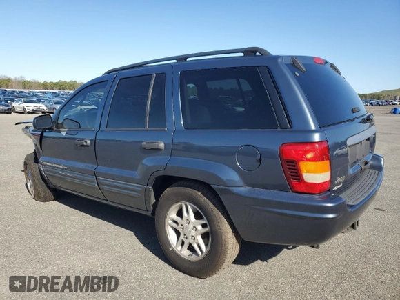 2004 Jeep Grand Cherokee Laredo z VIN 1J4GW48S74C159381, wystawiony jako Copart lot #53972115 z przebiegiem 128 309 mil mil oraz Szkoda całkowita • Salvage title. Historia ofert i sprzedaży dostępna na DreamBid. Obrazek 2.