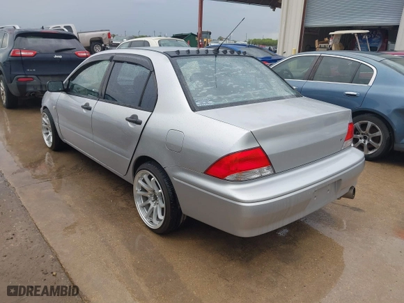 2003 Mitsubishi Lancer ES with VIN JA3AJ26E43U038813, listed as a IAAI auction lot 41778956 with 150,764 mi miles. Bid and sale history available at carsss.com. Image 3.