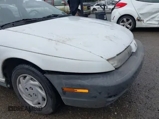 1997 Saturn SL with VIN 1G8ZF5283VZ400170, listed as a IAAI auction lot 41884490 with 171,635 mi miles. Bid and sale history available at carsss.com. Image 6.