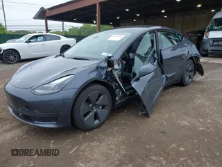 2023 Tesla Model 3 with VIN 5YJ3E1EA9PF673399, listed as a IAAI auction lot 42392643 with 7,571 mi miles and . Bid and sale history available at DreamBid. Image 6.