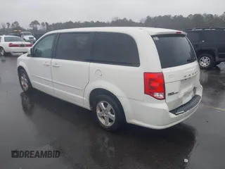 2012 Dodge Grand Caravan SXT with VIN 2C4RDGCG4CR304472, listed as a IAAI auction lot 41396437 with 180,309 mi miles and . Bid and sale history available at DreamBid. Image 3.