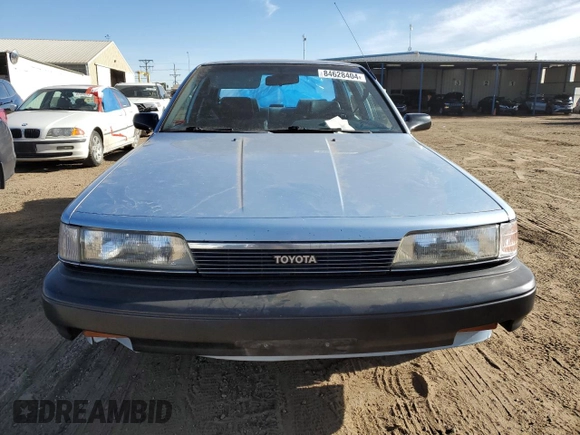 1990 Toyota Camry z VIN 4T1SV24E0LU137556, wystawiony jako Copart lot #84628404 z przebiegiem 247 203 mil mil oraz Czysty tytuł • Clean title. Historia ofert i sprzedaży dostępna na DreamBid. Obrazek 5.