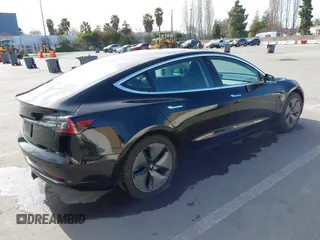 2019 Tesla Model 3 Mid Range with VIN 5YJ3E1EA2KF305834, listed as a IAAI auction lot 41719610 with 126,333 mi miles and . Bid and sale history available at DreamBid. Image 4.