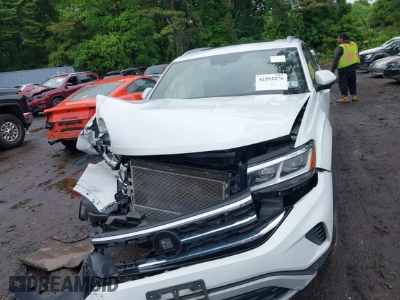 2021 Volkswagen Atlas SE z VIN 1V2KE2CAXMC202664, wystawiony jako IAAI lot #42292276 z przebiegiem 57 760 mil mil oraz . Historia ofert i sprzedaży dostępna na DreamBid. Obrazek 12.