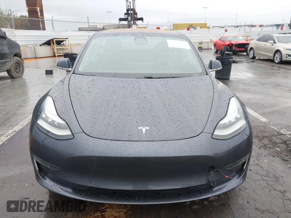 2018 Tesla Model 3 Long Range Battery with VIN 5YJ3E1EB7JF114305, listed as a IAAI auction lot 41765994 with 76,945 mi miles and . Bid and sale history available at DreamBid. Image 13.