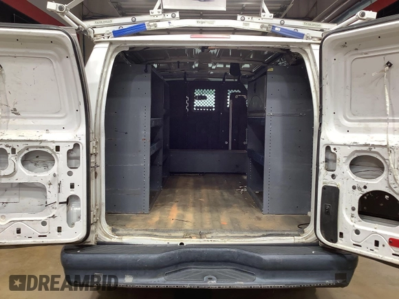 2013 Ford Econoline Cargo Commercial with VIN 1FTNE1EW9DDA61968, listed as a IAAI auction lot 42643038 with 121,719 mi miles and . Bid and sale history available at DreamBid. Image 6.
