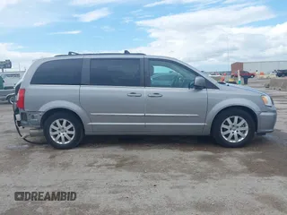 2016 Chrysler Town & Country Touring with VIN 2C4RC1BG0GR213058, listed as a IAAI auction lot 41910462 with 125,013 mi miles and . Bid and sale history available at DreamBid. Image 13.