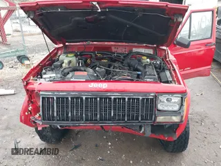 1996 Jeep Cherokee Sport with VIN 1J4FJ68S6TL299152, listed as a IAAI auction lot 41004736 with 277,819 mi miles. Bid and sale history available at carsss.com. Image 10.