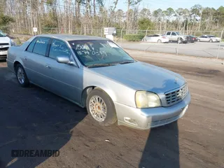 2004 Cadillac DeVille DHS z VIN 1G6KE54Y44U214112, wystawiony jako IAAI lot #41563736 z przebiegiem Nie podano mil oraz . Historia ofert i sprzedaży dostępna na DreamBid. Obrazek 1.