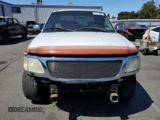 2002 Ford F-150 XL with VIN 1FTRX17212NA28461, listed as a Copart auction lot 63710665 with 185,460 mi miles and Salvage title. Bid and sale history available at DreamBid. Image 5.