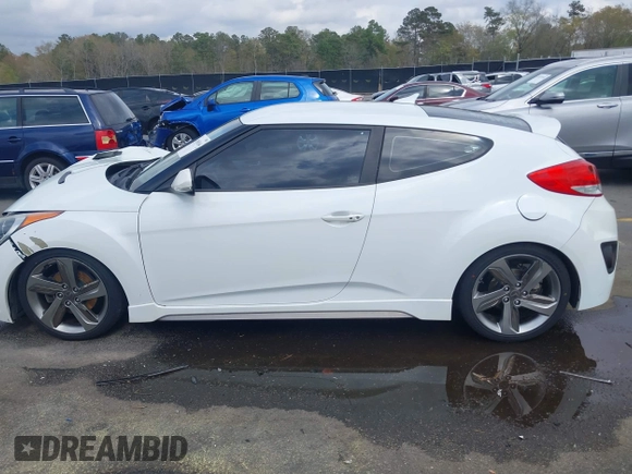 2013 Hyundai Veloster Turbo z VIN KMHTC6AE6DU112233, wystawiony jako IAAI lot #41869164 z przebiegiem 151 091 mil mil oraz . Historia ofert i sprzedaży dostępna na DreamBid. Obrazek 14.