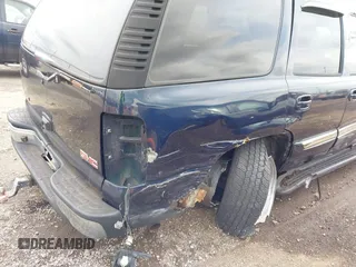 2004 GMC Yukon SLT with VIN 1GKEK13Z74R114583, listed as a IAAI auction lot 41834400 with 311,567 mi miles. Bid and sale history available at carsss.com. Image 6.