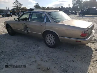1998 Jaguar XJ with VIN SAJHX1242WC845736, listed as a Copart auction lot 82006044 with 188,785 mi miles and Salvage title. Bid and sale history available at DreamBid. Image 2.