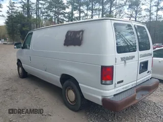 2001 Ford Econoline Cargo with VIN 1FTRE14261HA74696, listed as a IAAI auction lot 41915335 with 124,282 mi miles. Bid and sale history available at carsss.com. Image 3.