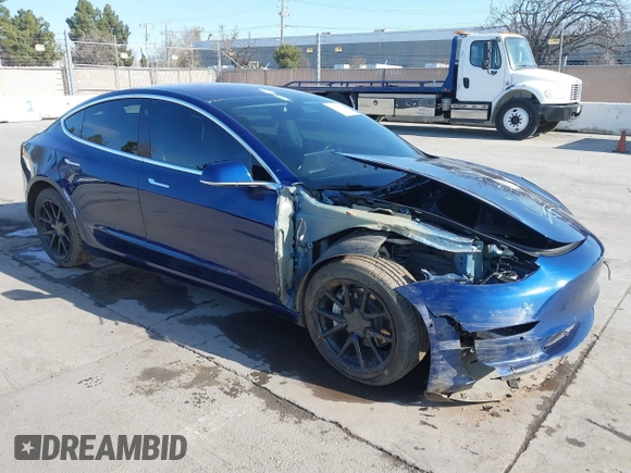 2018 Tesla Model 3 Long Range Battery with VIN 5YJ3E1EA4JF011799, listed as a IAAI auction lot 41765860 with 133,098 mi miles. Bid and sale history available at carsss.com. Image 1.