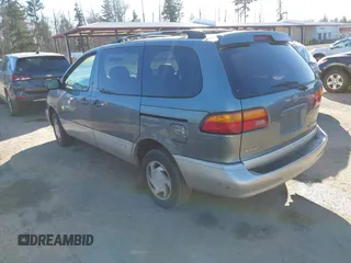 1999 Toyota Sienna LE with VIN 4T3ZF13C3XU103436, listed as a IAAI auction lot 41667242 with 228,318 mi miles. Bid and sale history available at carsss.com. Image 3.