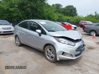 2018 Ford Fiesta SE z VIN 3FADP4BJ6JM106855, wystawiony jako IAAI lot #42491262 z przebiegiem 166 397 mil mil oraz . Historia ofert i sprzedaży dostępna na DreamBid. Obrazek 1.