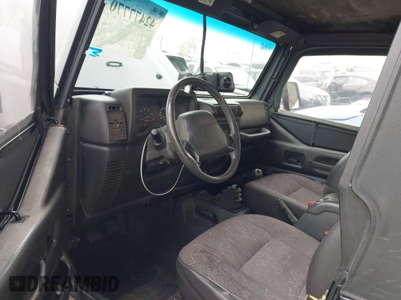 2002 Jeep Wrangler Sport with VIN 1J4FA49S02P705470, listed as a IAAI auction lot 42477770 with 59,395 mi miles and . Bid and sale history available at DreamBid. Image 5.