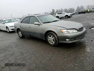 2000 Lexus ES 300 with VIN JT8BF28GXY5091263, listed as a Copart auction lot 61767595 with 250,041 mi miles and Salvage title. Bid and sale history available at DreamBid. Image 10.