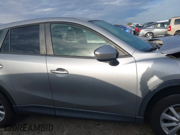 2015 Mazda CX-5 Touring with VIN JM3KE2CYXF0435583, listed as a IAAI auction lot 41737810 with 107,270 mi miles and . Bid and sale history available at DreamBid. Image 13.