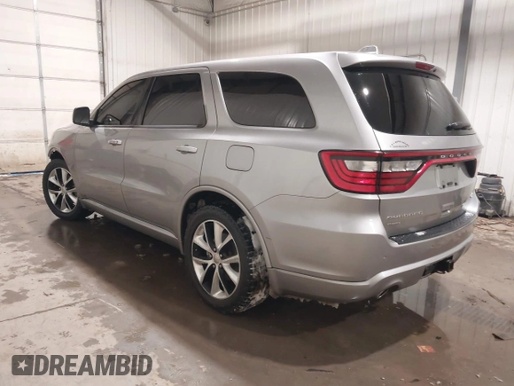 2014 Dodge Durango R/T with VIN 1C4SDJCTXEC558937, listed as a IAAI auction lot 41570244 with 174,724 mi miles and . Bid and sale history available at DreamBid. Image 3.
