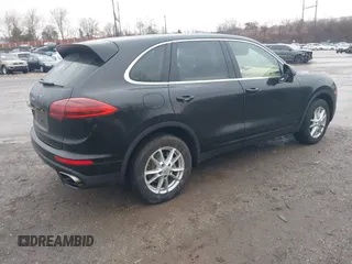 2016 Porsche Cayenne with VIN WP1AA2A28GLA06519, listed as a IAAI auction lot 41520326 with 144,828 mi miles. Bid and sale history available at carsss.com. Image 4.