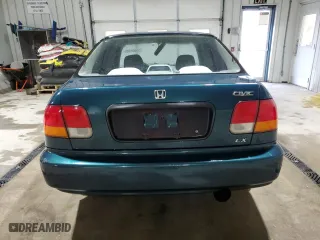 1997 Honda Civic LX with VIN 1HGEJ6572VL027980, listed as a Copart auction lot 53024335 with 269,396 mi miles and Salvage Title. Bid and sale history available at carsss.com. Image 6.