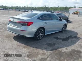 2023 Honda Civic Touring with VIN 2HGFE1F91PH305053, listed as a IAAI auction lot 42378311 with 41,576 mi miles and . Bid and sale history available at DreamBid. Image 4.