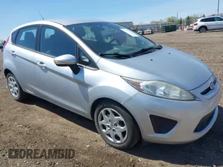 2013 Ford Fiesta SE with VIN 3FADP4EJ9DM157685, listed as a IAAI auction lot 42145511 with 101,331 mi miles. Bid and sale history available at carsss.com. Image 1.