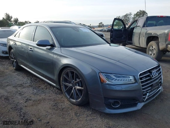 2016 Audi A8 L 4.0T Sport with VIN WAU43AFD1GN008031, listed as a IAAI auction lot 41390435 with 153,152 mi miles. Bid and sale history available at carsss.com. Image 1.