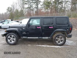 2016 Jeep Wrangler Unlimited 75th Anniversary with VIN 1C4HJWEG3GL181371, listed as a IAAI auction lot 41864965 with 64,259 mi miles and . Bid and sale history available at DreamBid. Image 14.