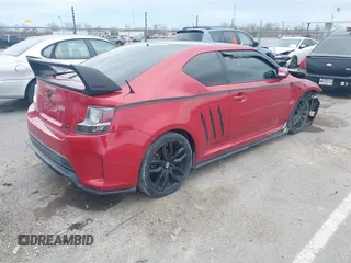 2016 Scion tC with VIN JTKJF5C74GJ026588, listed as a IAAI auction lot 41582253 with 74,023 mi miles. Bid and sale history available at carsss.com. Image 4.
