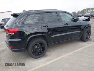 2019 Jeep Grand Cherokee Laredo E with VIN 1C4RJEAGXKC571770, listed as a IAAI auction lot 41677487 with 113,089 mi miles. Bid and sale history available at carsss.com. Image 4.