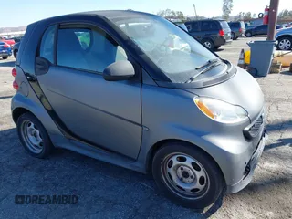 2013 Smart fortwo Pure with VIN WMEEJ3BA1DK647416, listed as a IAAI auction lot 41676693 with 102,772 mi miles. Bid and sale history available at carsss.com. Image 1.
