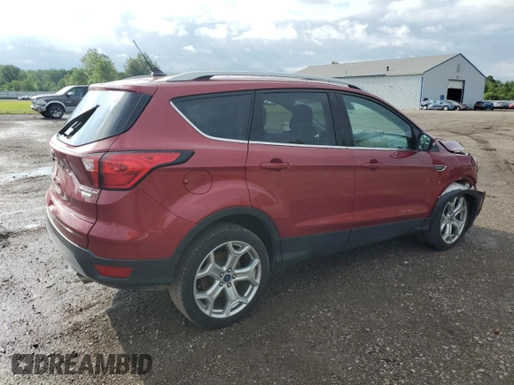 2019 Ford Escape Titanium with VIN 1FMCU0J98KUC00873, listed as a Copart auction lot 61674305 with 53,554 mi miles and Salvage title. Bid and sale history available at DreamBid. Image 3.