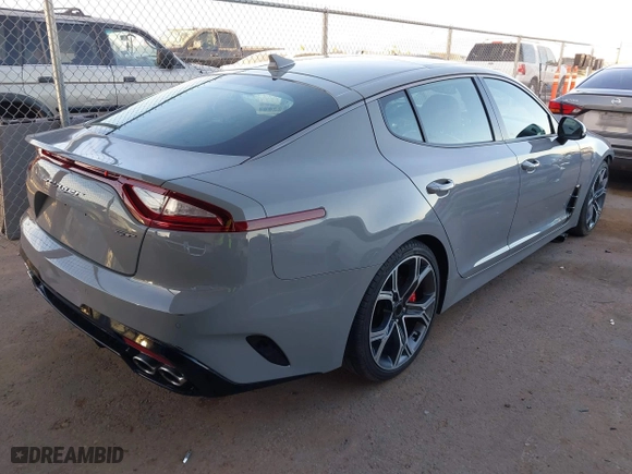 2020 Kia Stinger GT2 with VIN KNAE55LC1L6075699, listed as a IAAI auction lot 41598898 with 58,894 mi miles. Bid and sale history available at carsss.com. Image 4.
