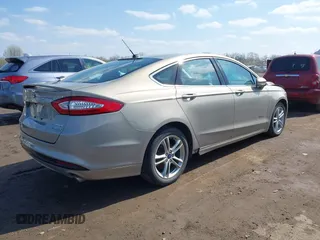 2016 Ford Fusion Titanium Hybrid with VIN 3FA6P0RU5GR171287, listed as a IAAI auction lot 41918195 with 74,721 mi miles. Bid and sale history available at carsss.com. Image 4.