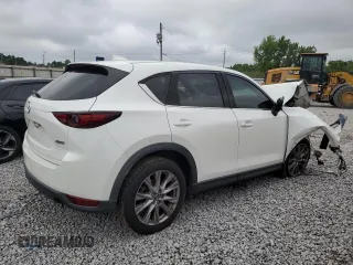 2019 Mazda CX-5 Grand Touring with VIN JM3KFADM6K1581261, listed as a Copart auction lot 59965175 with 127,837 mi miles and Salvage title. Bid and sale history available at DreamBid. Image 3.