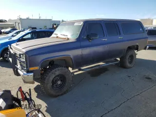 1991 GMC Suburban z VIN 1GKEV16K9MF510909, wystawiony jako Copart lot #81326004 z przebiegiem 216 778 mil mil oraz Tytuł czysty. Historia ofert i sprzedaży dostępna na DreamBid. Obrazek 1.