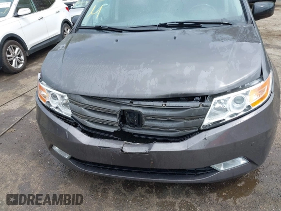 2013 Honda Odyssey Touring with VIN 5FNRL5H94DB013310, listed as a IAAI auction lot 42079565 with 128,622 mi miles and . Bid and sale history available at carsss.com. Image 6.