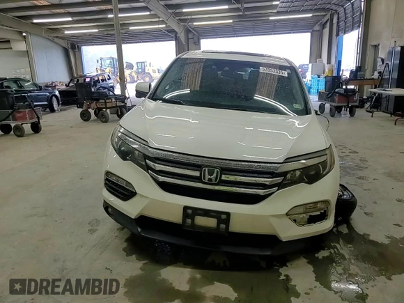 2018 Honda Pilot EX-L with VIN 5FNYF6H62JB043318, listed as a Copart auction lot 57853335 with 57,354 mi miles and Salvage title. Bid and sale history available at DreamBid. Image 15.